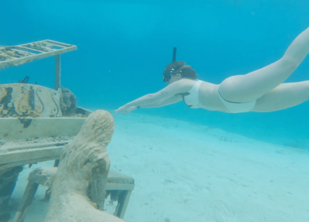Underwater mermaid and piano sculpture